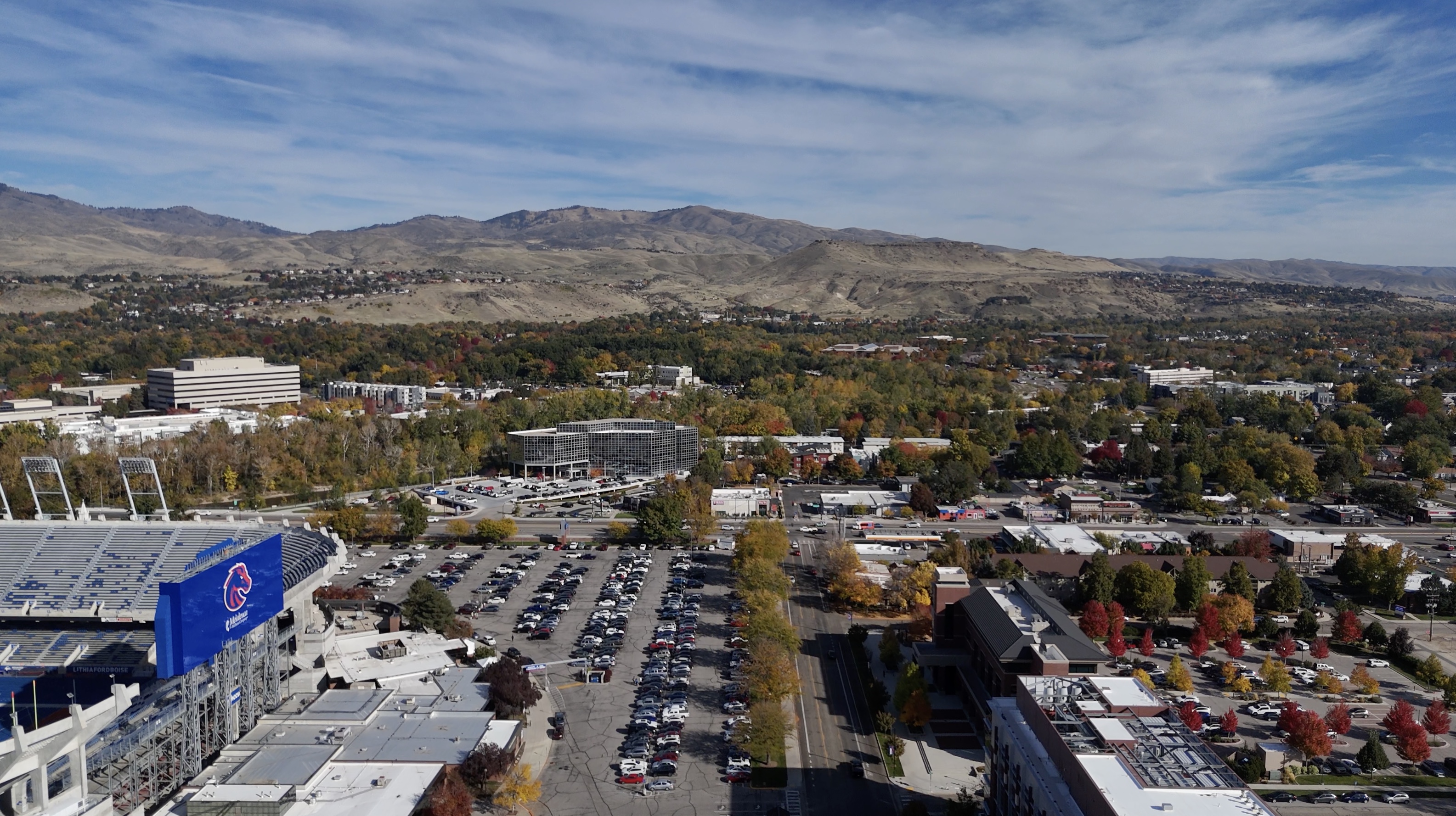 Drone image of Boise Foothills with Boise State university campus below next to the Boise River